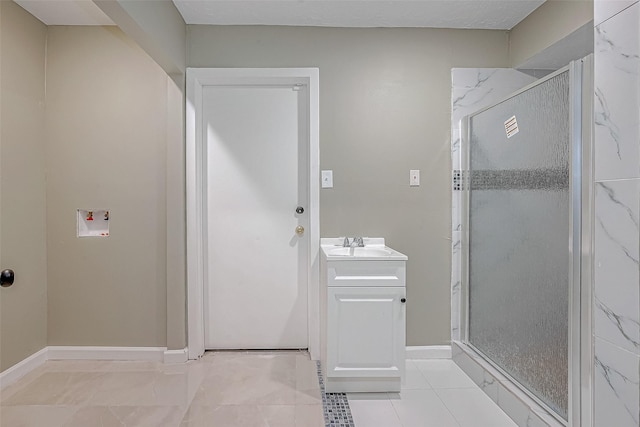 bathroom featuring vanity, tile patterned flooring, and a shower with door