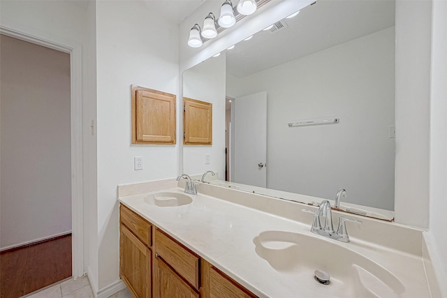 bathroom with vanity and tile patterned floors