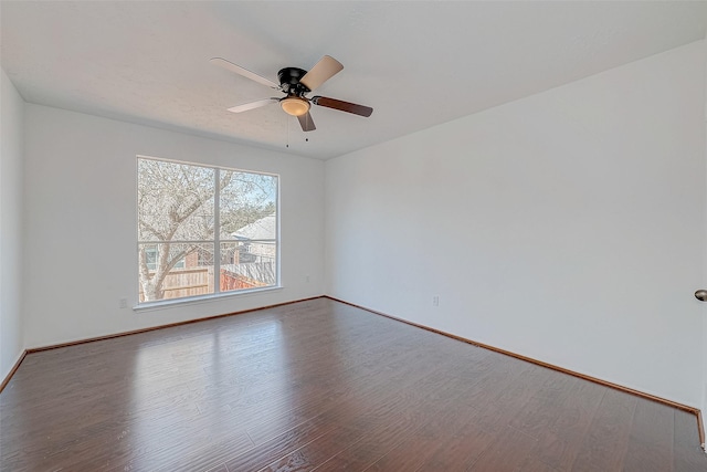 spare room featuring hardwood / wood-style flooring and ceiling fan