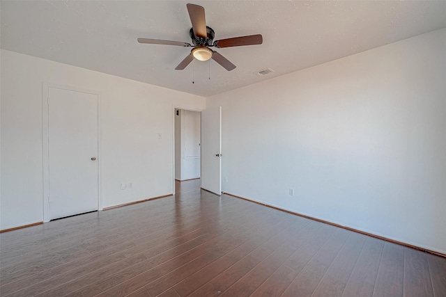 spare room with wood-type flooring and ceiling fan