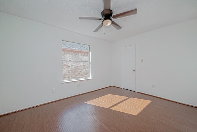 unfurnished room with hardwood / wood-style floors and ceiling fan