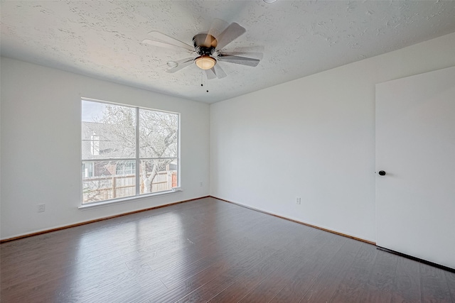 unfurnished room featuring hardwood / wood-style flooring, ceiling fan, and a textured ceiling