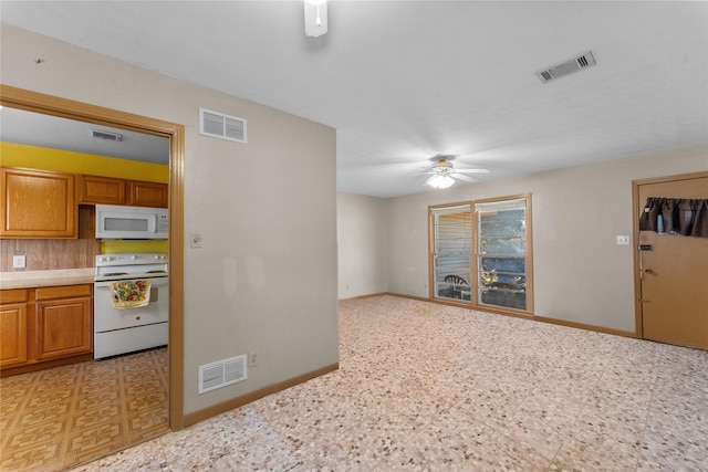 kitchen featuring white appliances and ceiling fan