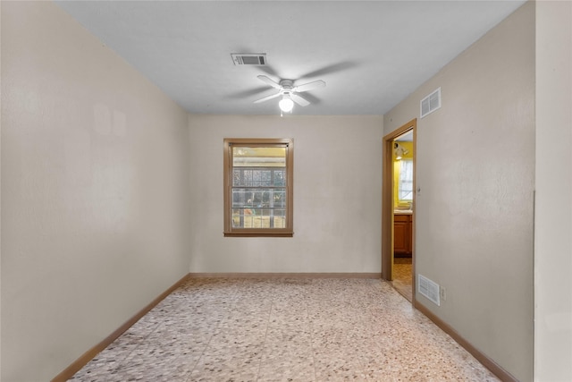 unfurnished room with ceiling fan