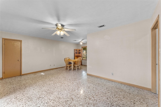 unfurnished room with ceiling fan