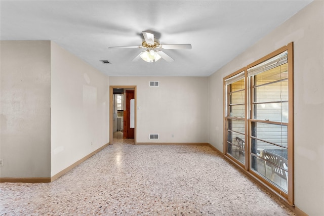 spare room with ceiling fan