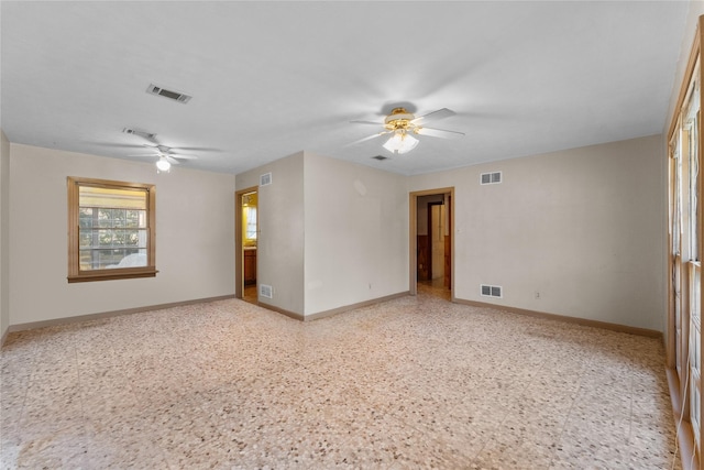 unfurnished room with ceiling fan