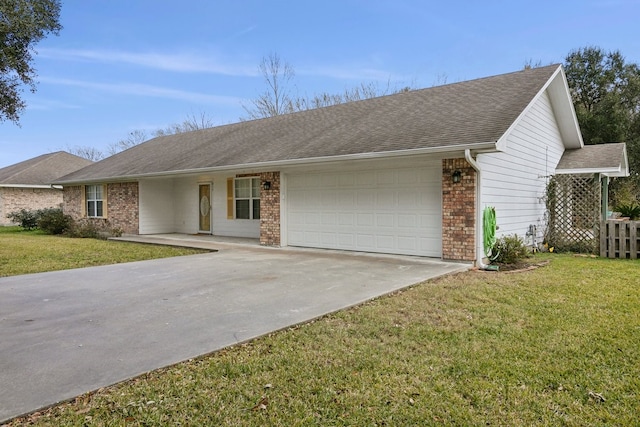 ranch-style house with a garage and a front lawn