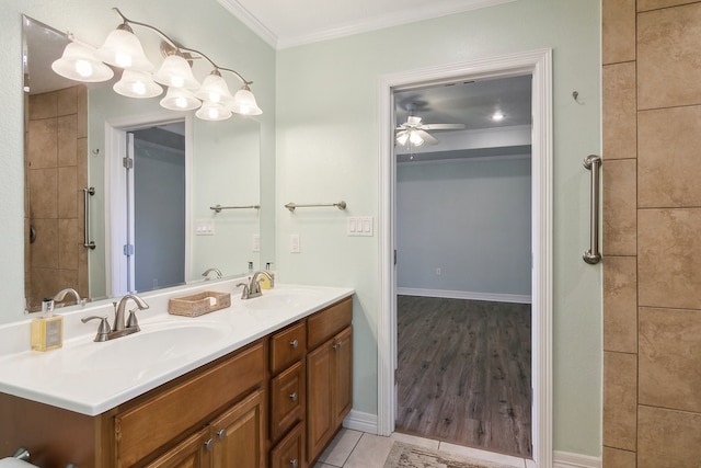 bathroom featuring tile patterned flooring, ornamental molding, vanity, and ceiling fan