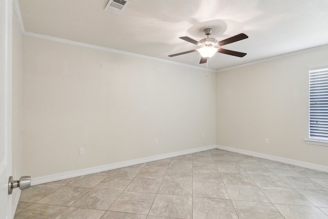 empty room featuring ornamental molding, ceiling fan, and light tile patterned flooring