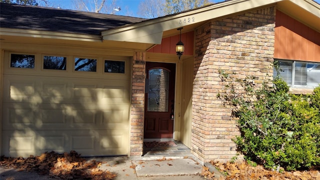 property entrance with a garage