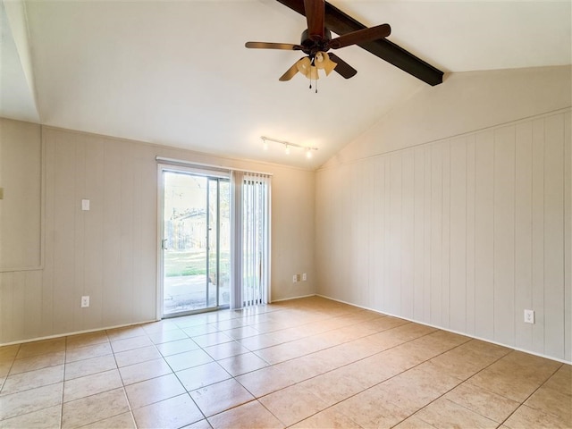 spare room featuring lofted ceiling with beams, light tile patterned floors, and ceiling fan