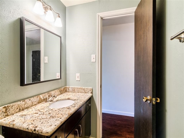 bathroom featuring vanity and hardwood / wood-style floors