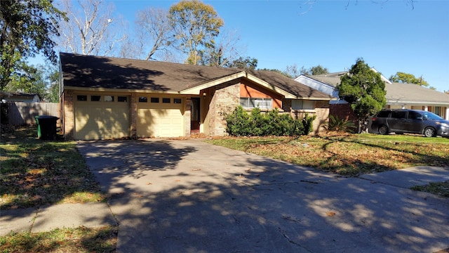 ranch-style home featuring a garage