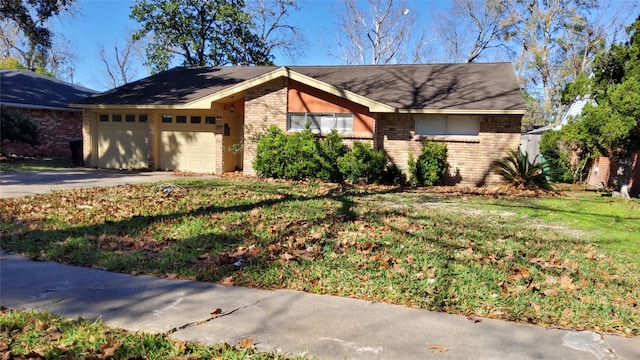 ranch-style house with a garage and a front yard