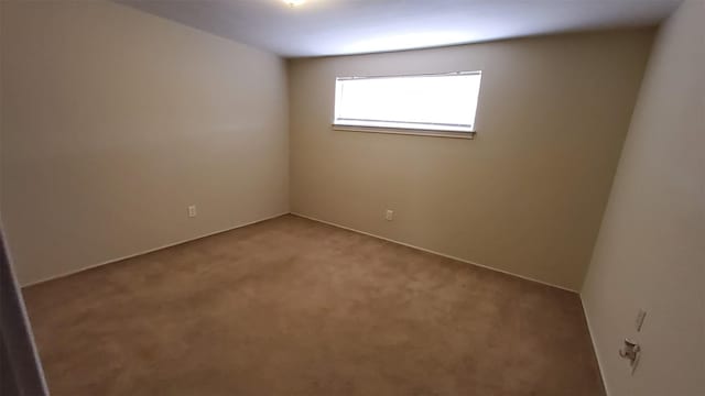 unfurnished room with carpet flooring