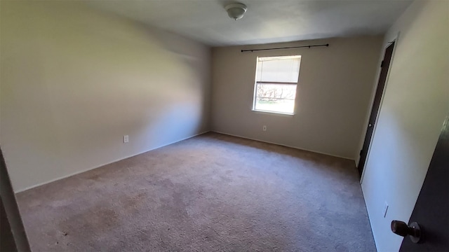 empty room with light colored carpet