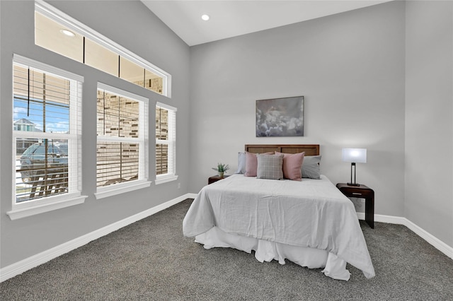 carpeted bedroom featuring recessed lighting, multiple windows, and baseboards