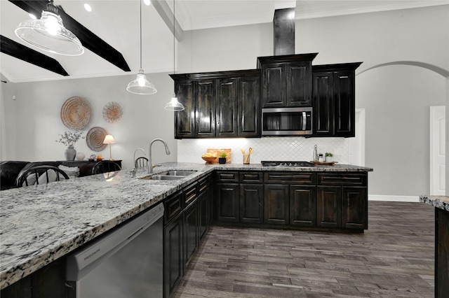 kitchen with arched walkways, appliances with stainless steel finishes, light stone countertops, crown molding, and a sink