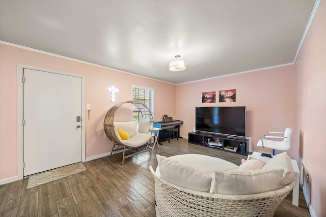 living room with crown molding and hardwood / wood-style floors