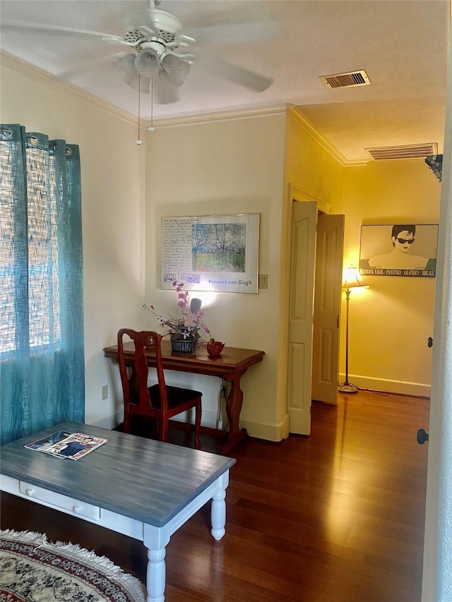 dining area featuring crown molding, dark hardwood / wood-style floors, and ceiling fan