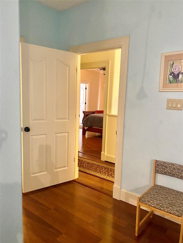 corridor with dark wood-type flooring