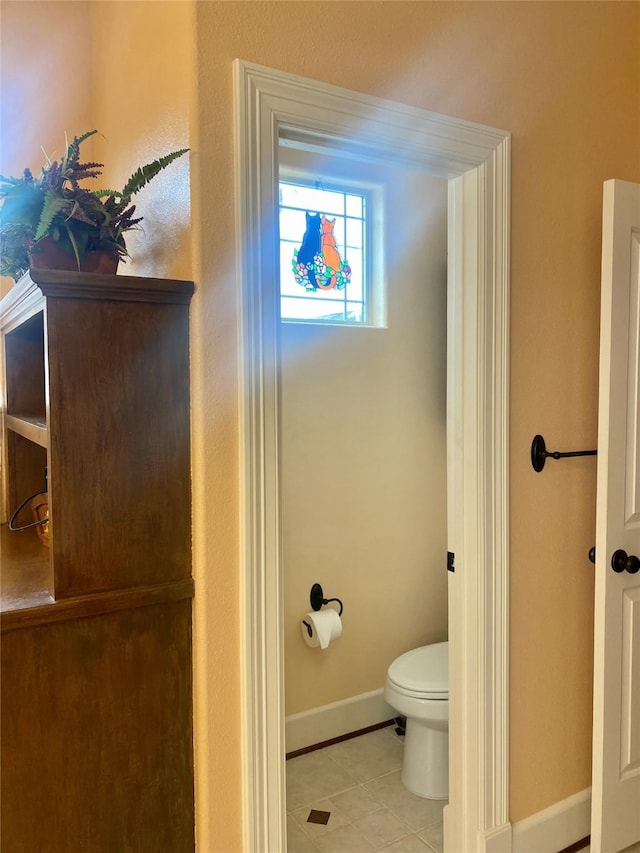 bathroom with tile patterned floors and toilet