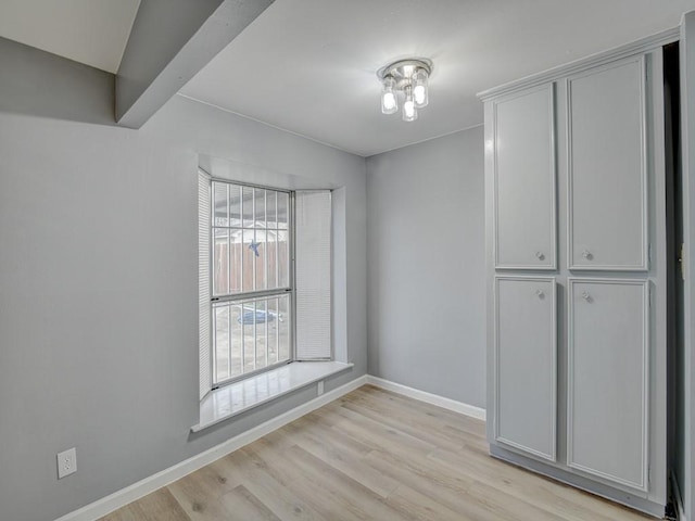 spare room featuring light hardwood / wood-style flooring