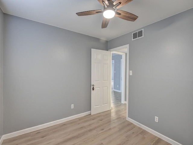 unfurnished room with ceiling fan and light hardwood / wood-style floors