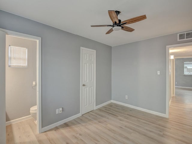 unfurnished bedroom with multiple windows, a closet, ceiling fan, and light hardwood / wood-style flooring