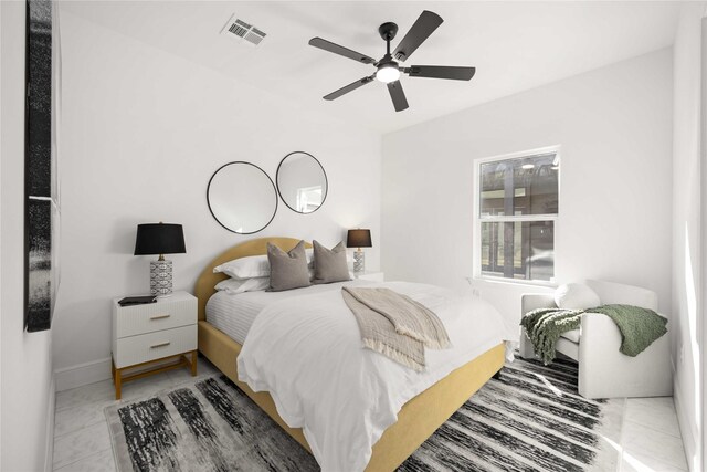 bedroom featuring ceiling fan and light tile patterned flooring