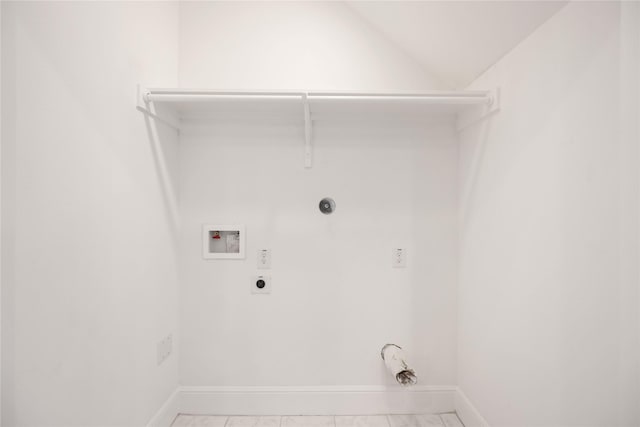 laundry area featuring light tile patterned floors, hookup for a gas dryer, hookup for a washing machine, and electric dryer hookup