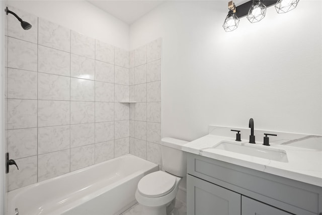 full bathroom with tiled shower / bath combo, vanity, and toilet