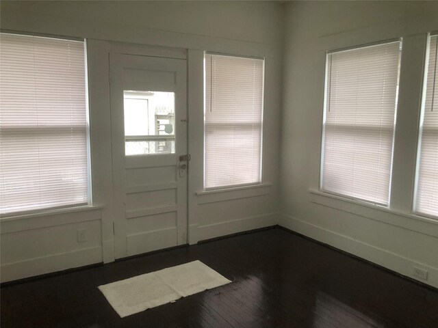 entrance foyer featuring dark hardwood / wood-style floors