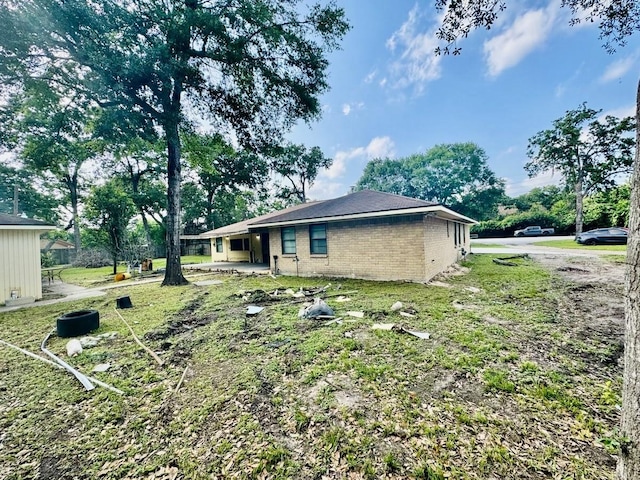 view of side of home with a patio area