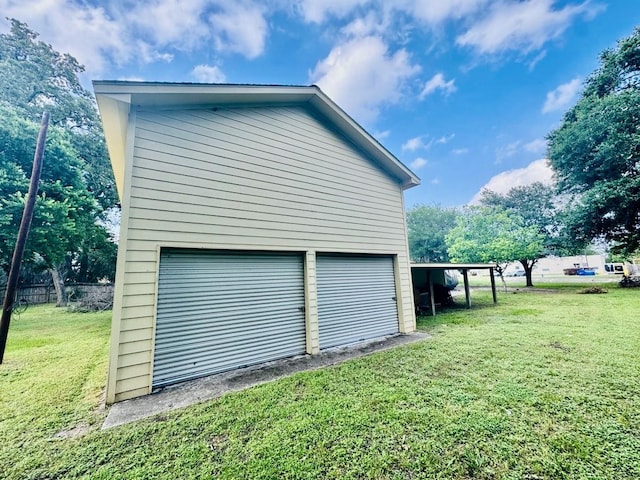 garage featuring a yard