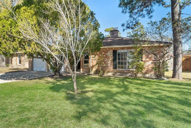 view of front of property featuring a garage and a front yard