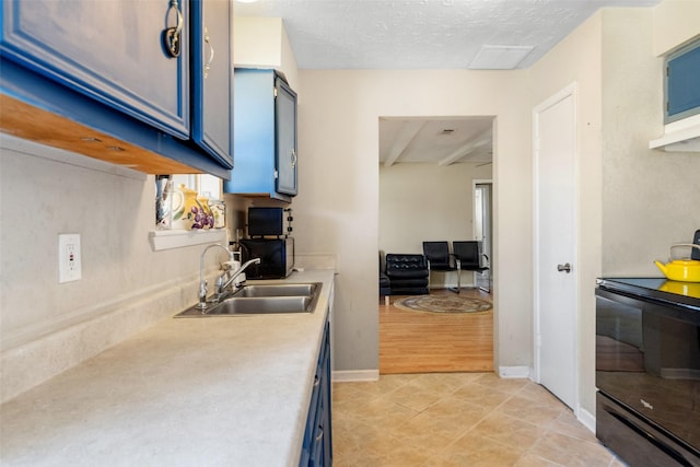 kitchen featuring blue cabinets, black electric range oven, sink, a textured ceiling, and light tile patterned floors