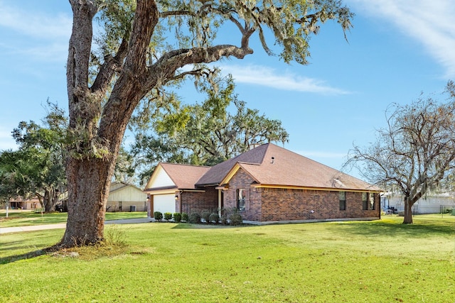 view of property exterior featuring a garage and a yard