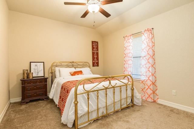 carpeted bedroom featuring ceiling fan and vaulted ceiling