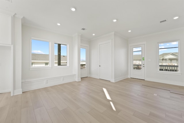 23015 Lunes, Galveston, TX 77554 - entrance foyer featuring crown molding, light wood finished floors, and recessed lighting