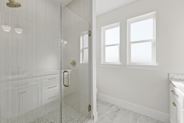 23015 Lunes, Galveston, TX 77554 - bathroom with a shower stall, vanity, toilet, baseboards, and marble finish floors