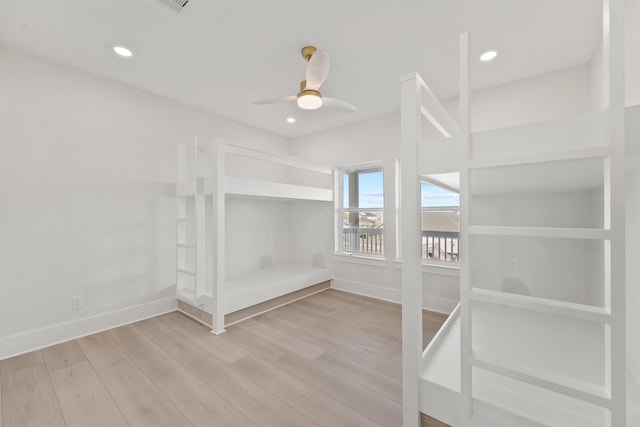 23015 Lunes, Galveston, TX 77554 - unfurnished bedroom featuring wood finished floors, baseboards, ceiling fan, and recessed lighting