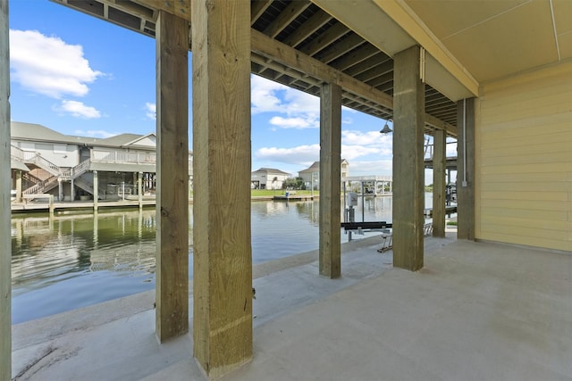 23015 Lunes, Galveston, TX 77554 - view of patio / terrace featuring a water view, a residential view, boat lift, and a boat dock
