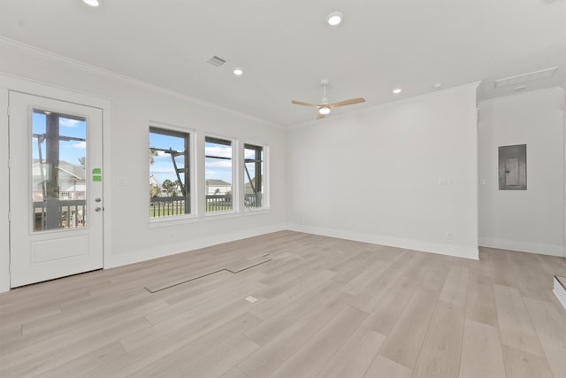 23015 Lunes, Galveston, TX 77554 - spare room featuring ornamental molding, light wood-type flooring, recessed lighting, electric panel, and baseboards