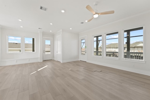 23015 Lunes, Galveston, TX 77554 - unfurnished living room with ornamental molding, healthy amount of natural light, light wood finished floors, recessed lighting, and a ceiling fan
