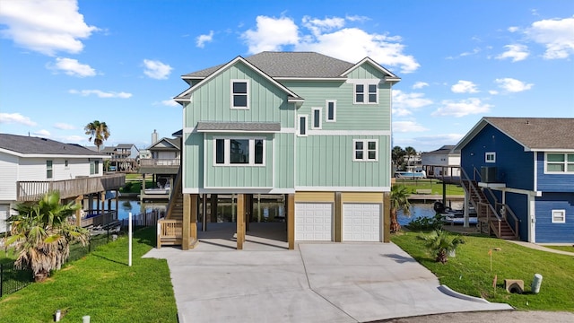 23015 Lunes, Galveston, TX 77554 - raised beach house with stairway, board and batten siding, driveway, and a carport