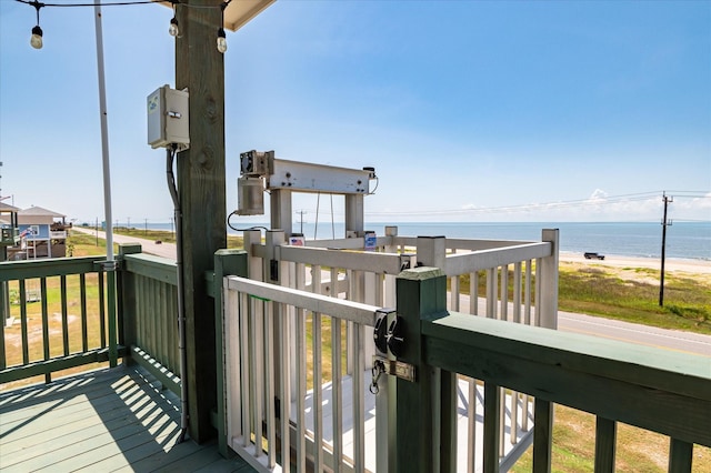 wooden deck with a water view