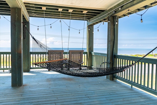 wooden terrace with a water view