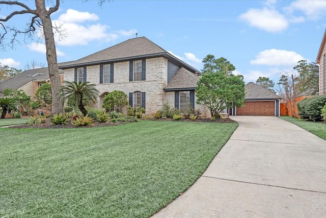 view of front of house featuring a garage and a front lawn